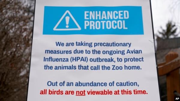 A sign tells visitors a<em></em>bout a closed bird exhibit at the Blank Park Zoo, April 5, 2022, in Des Moines, Iowa. Zoos across North America are taking steps to protect birds from avian influenza.