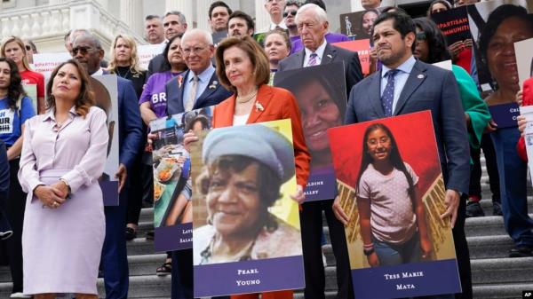 From left, Rep. Vero<em></em>nica Escobar, D-Texas, House Speaker Nancy Pelosi of California, and Rep. Jimmy Gomez, D-Calif., attend an event on the steps of the U.S. Capitol a<em></em>bout gun violence, June 24, 2022. 
