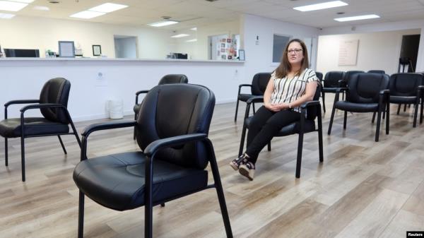 Andrea Gallegos, executive director of the Tulsa Women's Clinic, sits in an empty waiting room that was o<em></em>nce crowded inside the clinic, in Tulsa, Oklahoma, June 20, 2022.