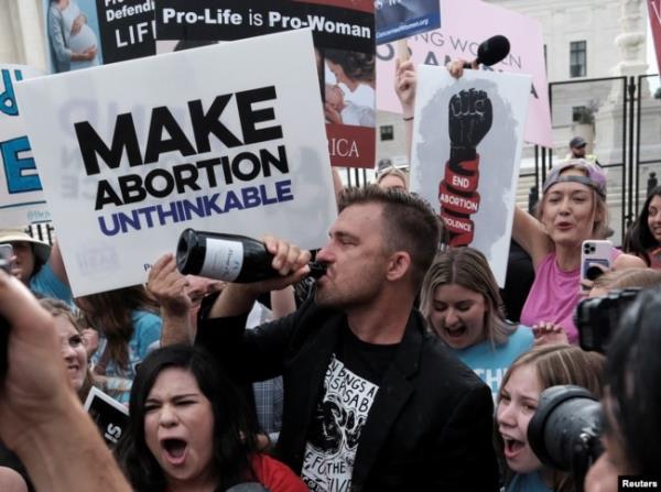 Anti-abortion demo<em></em>nstrators celebrate outside the United States Supreme Court as the court rules in the Dobbs v Women’s Health Organization abortion case, overturning the landmark Roe v Wade abortion decision in Washington, U.S., June 24, 2022.