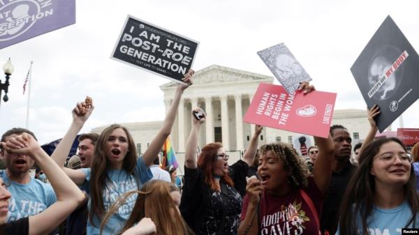 Anti-abortion demo<em></em>nstrators celebrate outside the United States Supreme Court as the court rules in the Dobbs v Women's Health Organization abortion case, overturning the landmark Roe v Wade abortion decision in Washington, U.S., June 24, 2022. 
