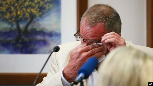 Neil Heslin, father of 6-year-old Sandy Hook shooting victim Jesse Lewis, becomes emotio<em></em>nal during his testimony during the trial for Alex Jones, Aug. 2, 2022, at the Travis County Courthouse in Austin.