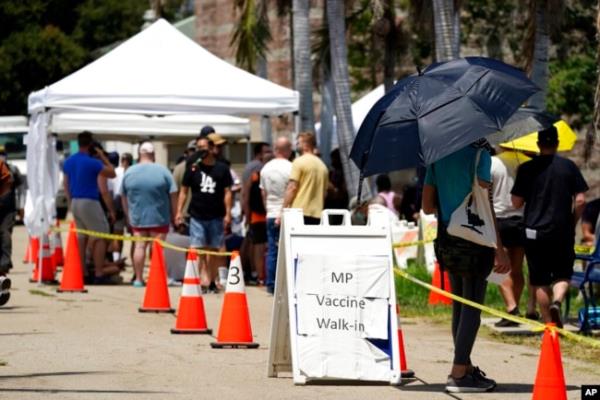 FILE - People line up at a mo<em></em>nkeypox vaccination site, in Encino, Calif., , July 28, 2022.