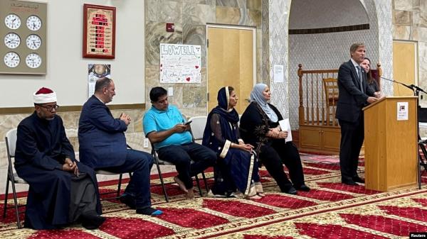 Albuquerque Mayor Tim Keller speaks to an interfaith memorial ceremony at the New Mexico Islamic Center mosque to commemorate four slain Muslim men, hours after police said they had arrested a prime suspect in the killings, in Albuquerque, N.M., Aug. 9, 2022.