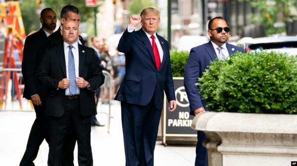 Former President Do<em></em>nald Trump gestures as he departs Trump Tower, Wednesday, Aug. 10, 2022, in New York, on his way to the New York attorney general's office for a deposition in a civil investigation.