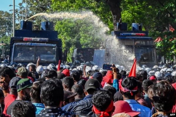 FILE - Police use water cannons to disperse anti-government protesters during a demo<em></em>nstration in Colombo, Sri Lanka, Sept. 24, 2022.