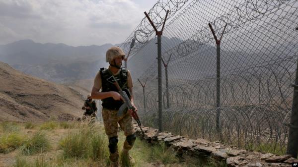 FILE - Pakistan Army troops patrol the Pakistan-Afghanistan border in Khyber district, Pakistan, Aug. 3, 2021.