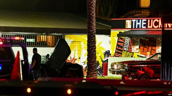 Bullet holes and broken glass are seen on a car being towed from the restaurant ‘The Licking’ wher<em></em>e a shooting investigation is being held in Miami Gardens, Florida, Miami, on January 5, 2023. 